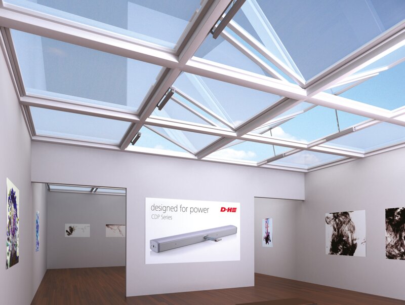 Highlighted image of a cdp drive in light-flooded gallery with glass roof surrounded by other images