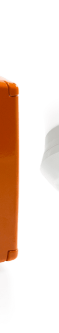 Close-up of an orange smoke vent button and smoke detector